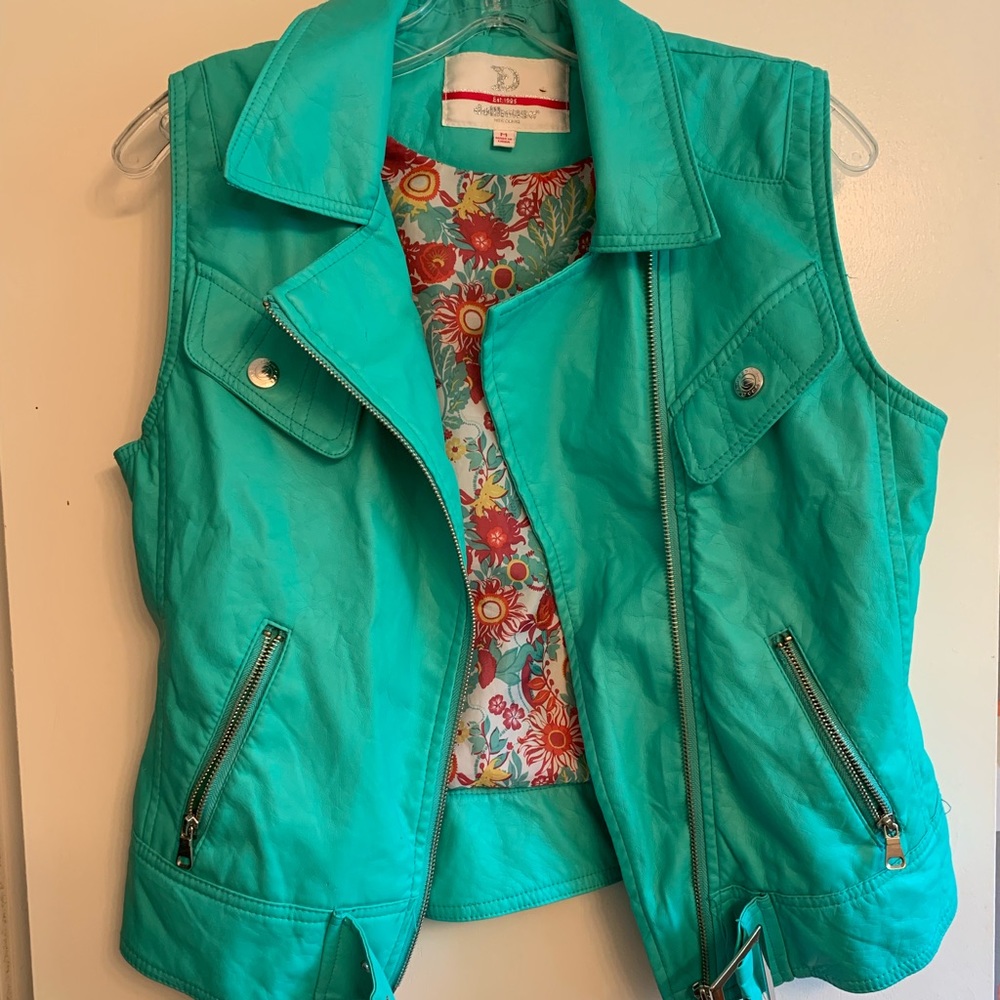 Turquoise zip up faux leather vest.